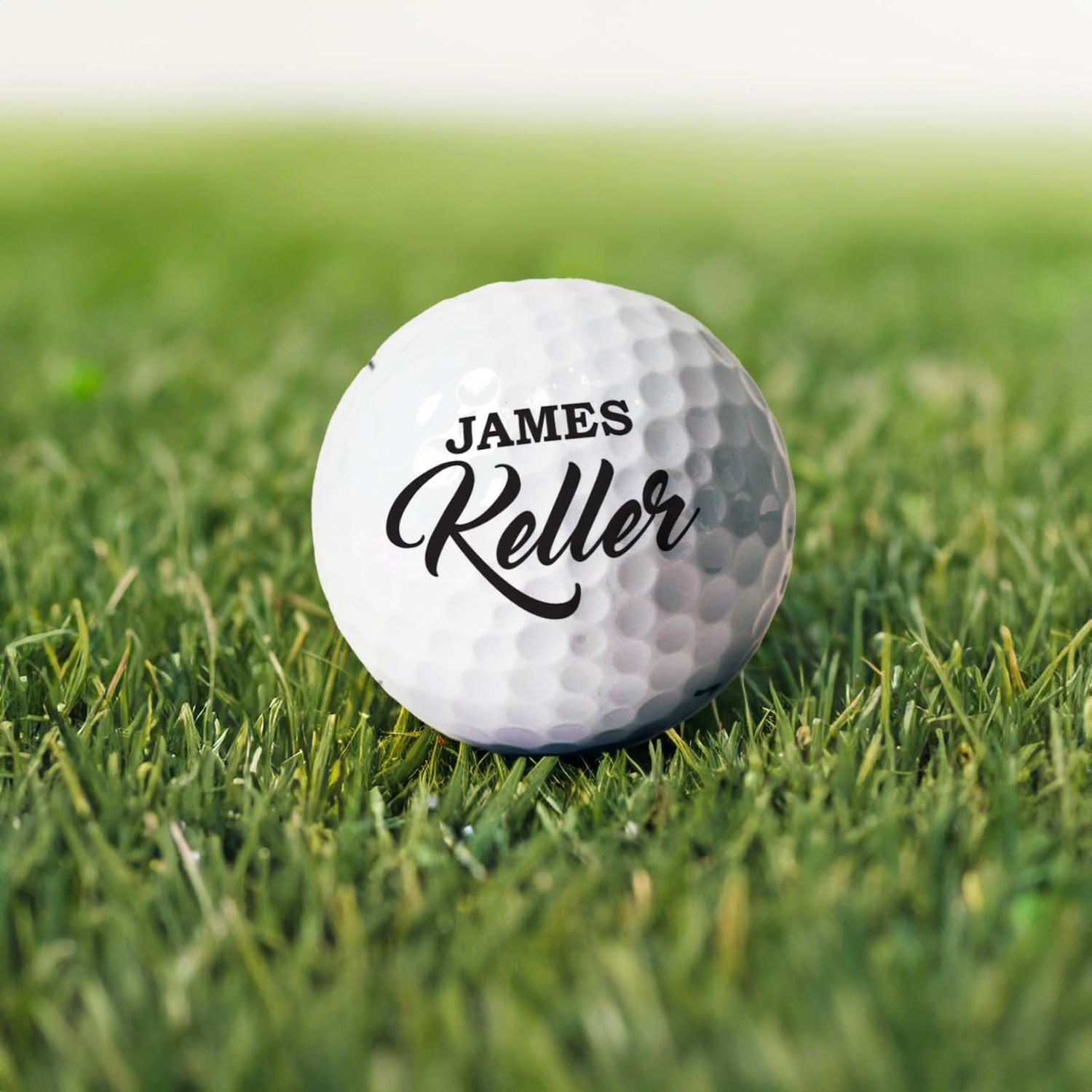 Personalized white golf ball with first and last name printed