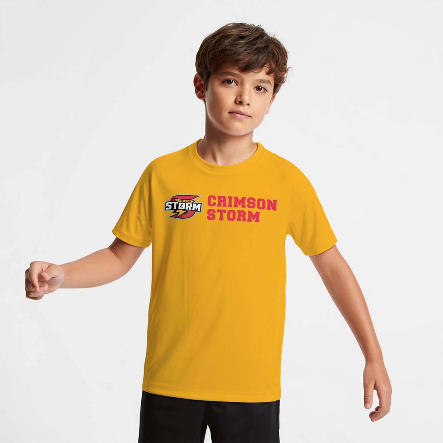 Child wearing a yellow t-shirt with 'CRIMSON STORM' text and logo