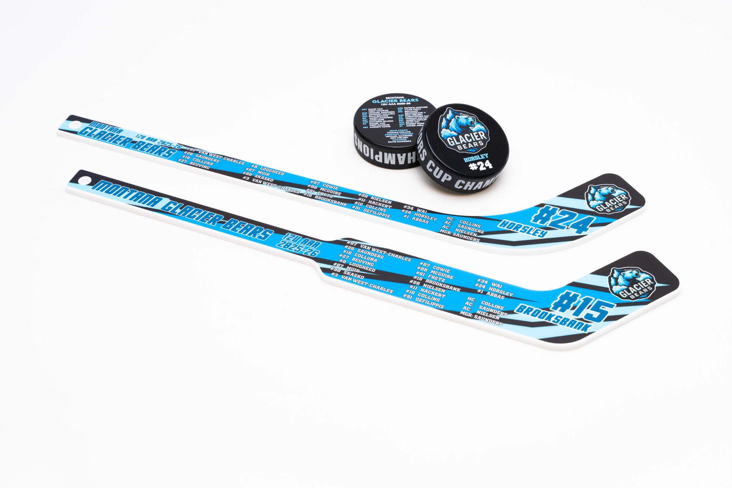 Two mini hockey sticks with pucks bundle