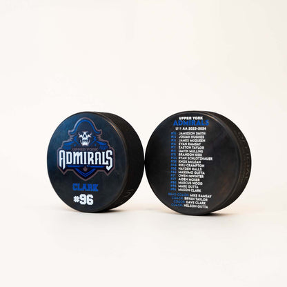 Personalized hockey pucks with team logo and team roster