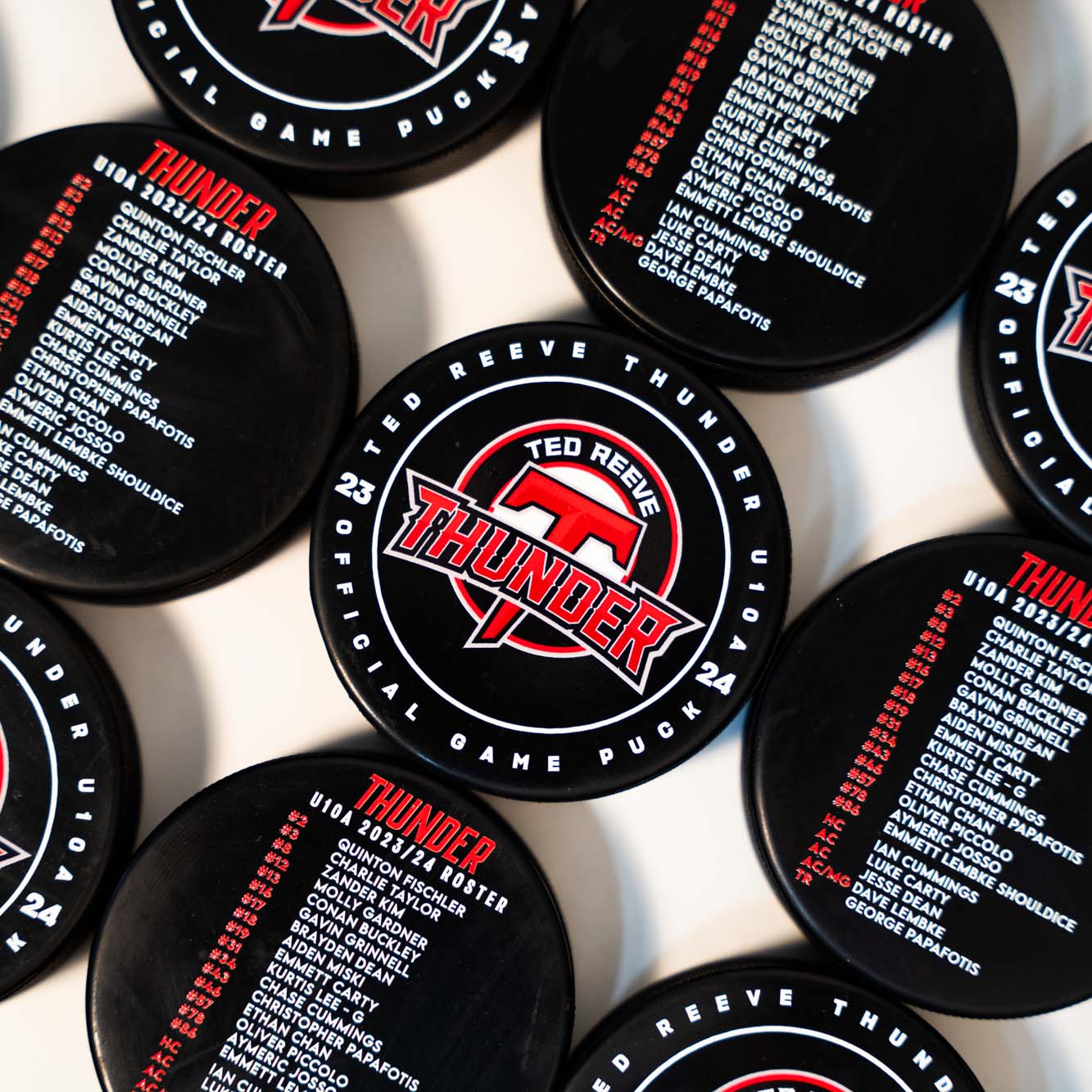 Full color team logo printed on bulk hockey pucks