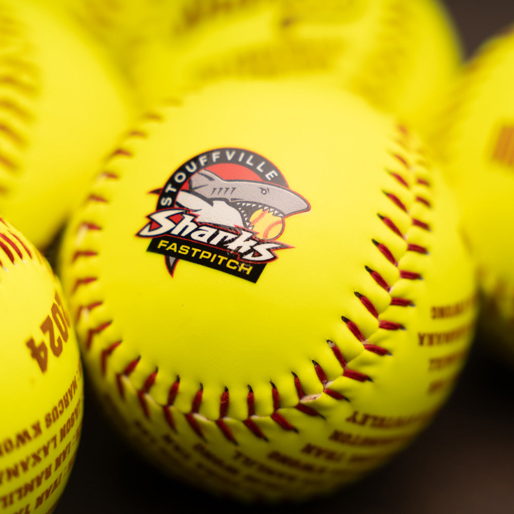 Fastpitch softball with team logo 