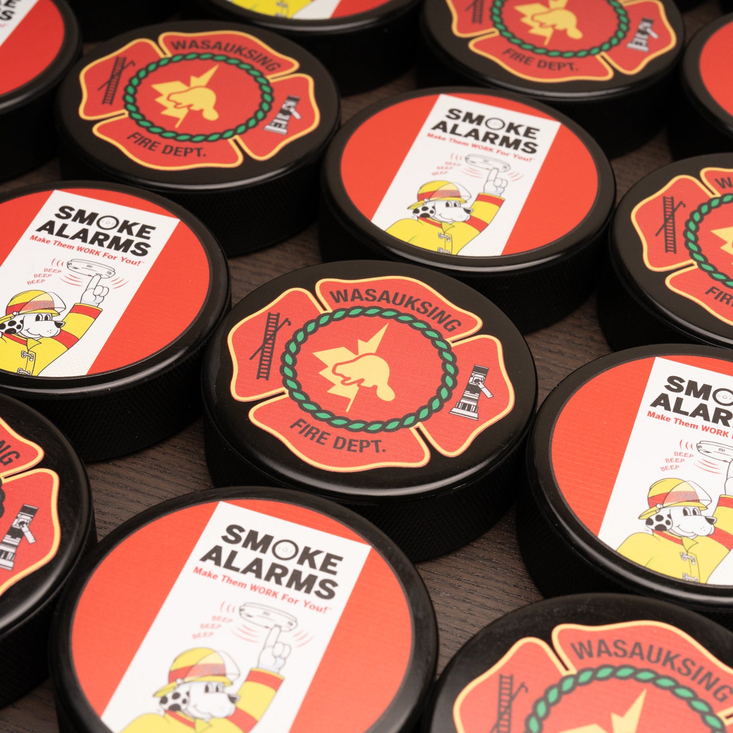 Custom printed hockey pucks for fire departmemt