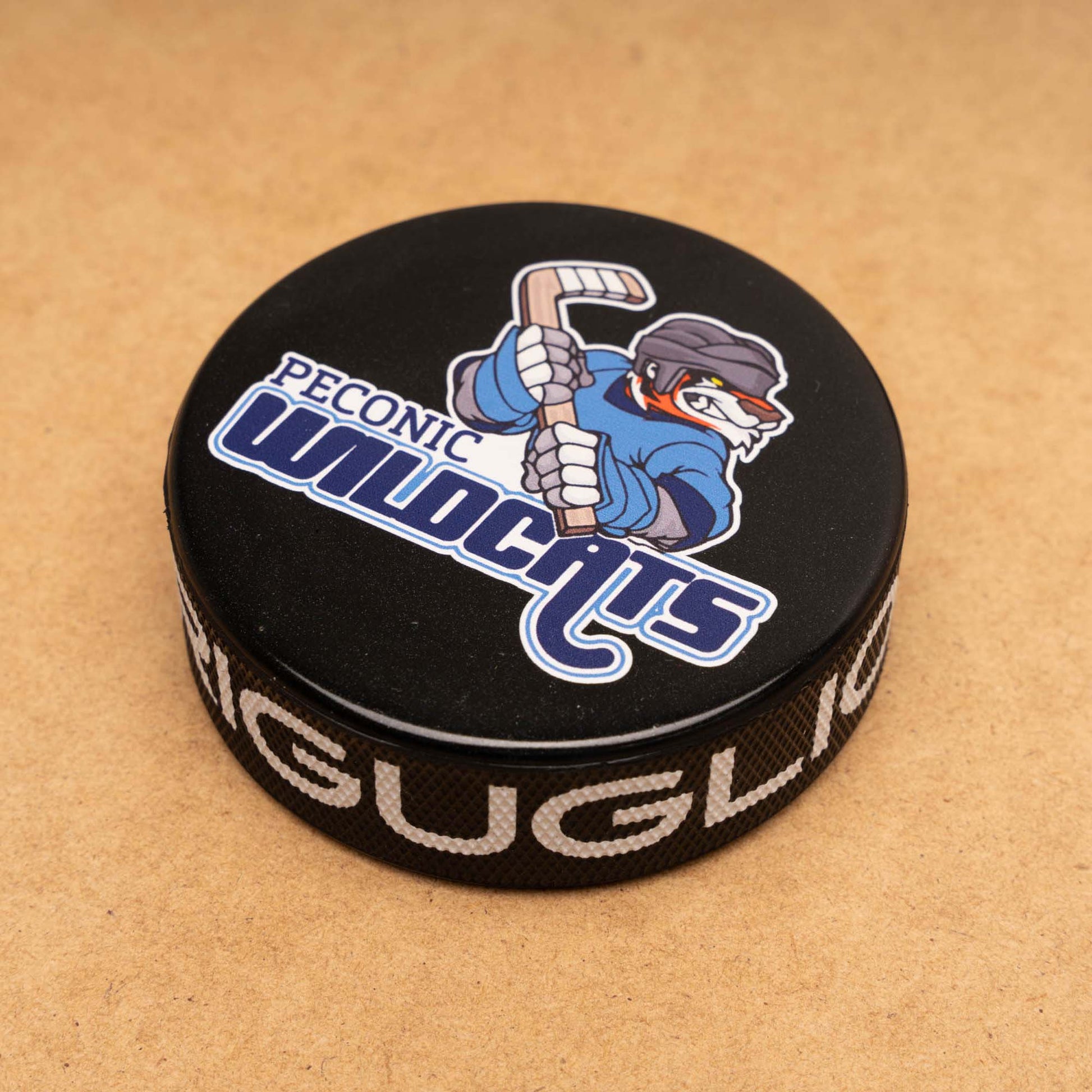Hockey puck with Peconic Wildcats logo and printed edge