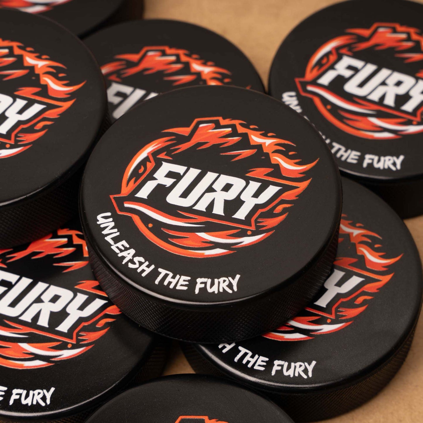 Pucks with 'Fury' branding and design