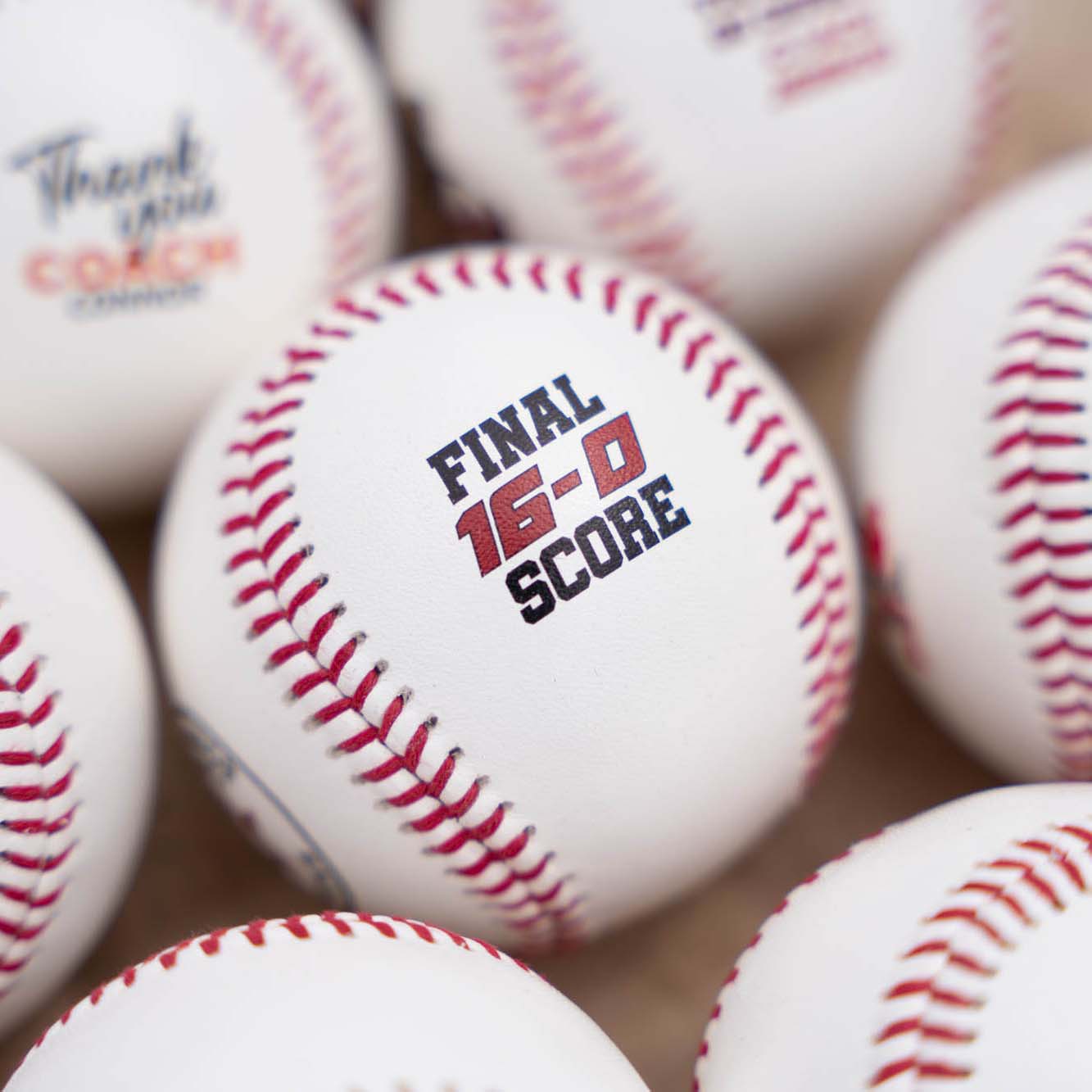 Baseballs with 'FINAL 16-0 SCORE' text 