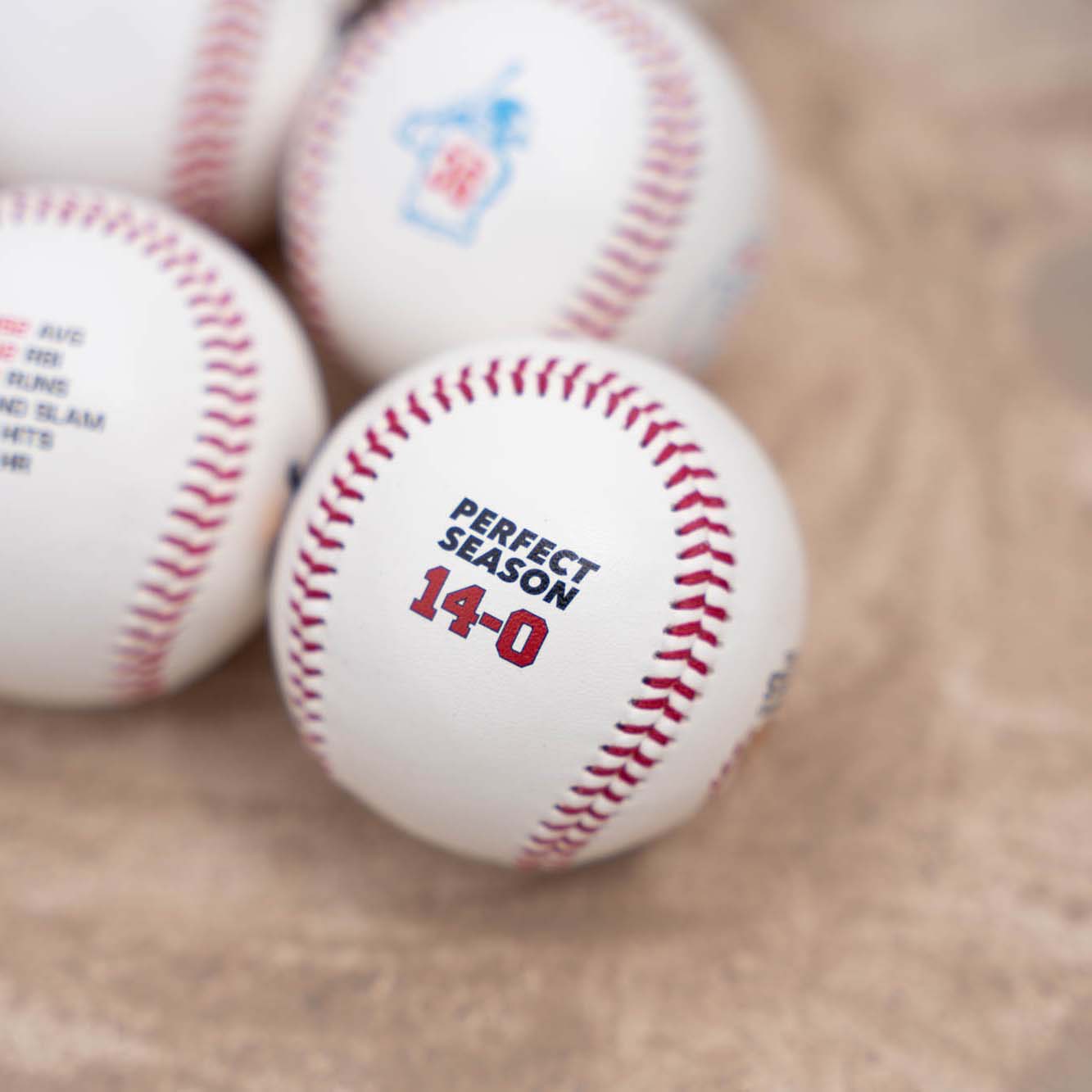 Baseball with 'Perfect Season 14-0' text 