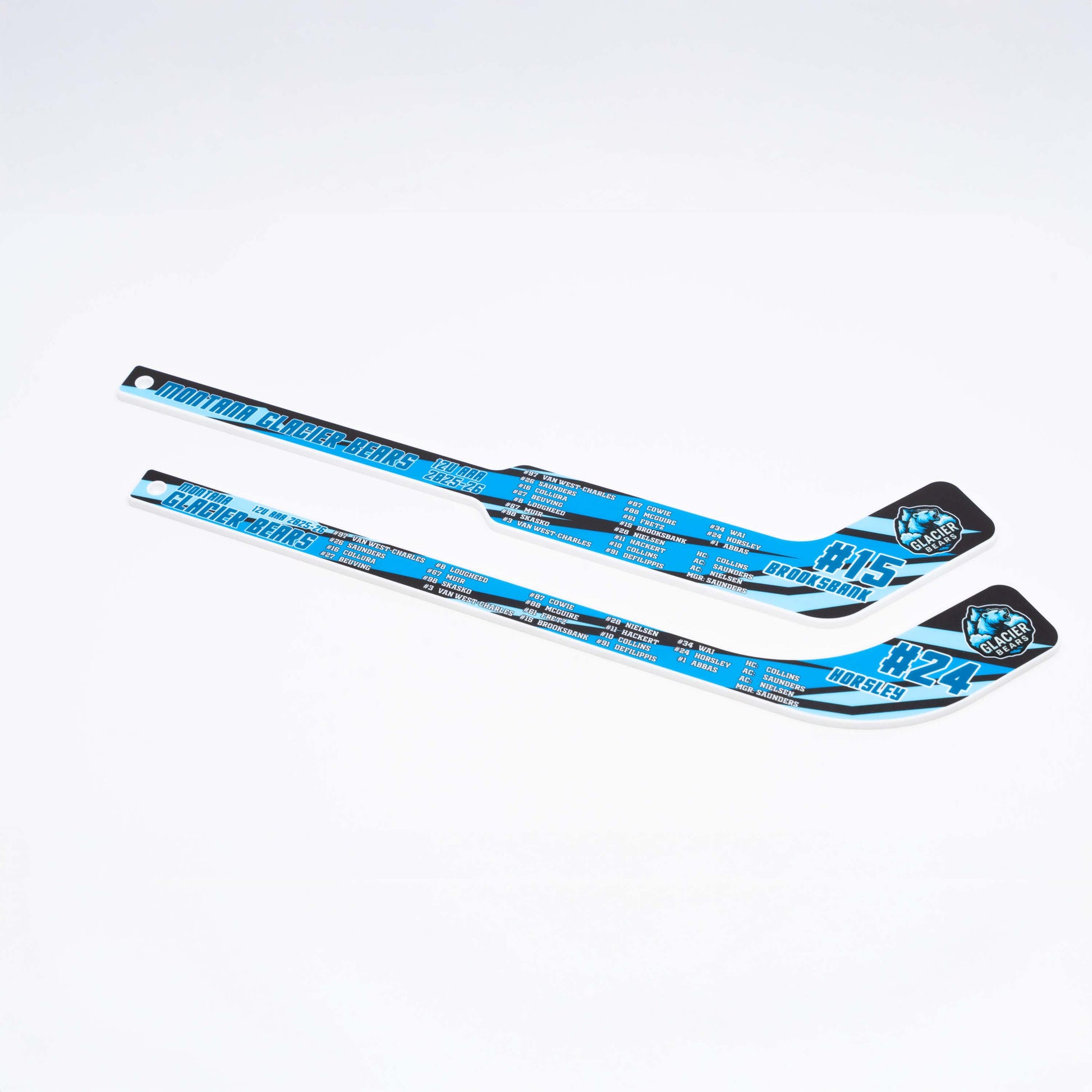 Two blue hockey sticks with printing on a white background