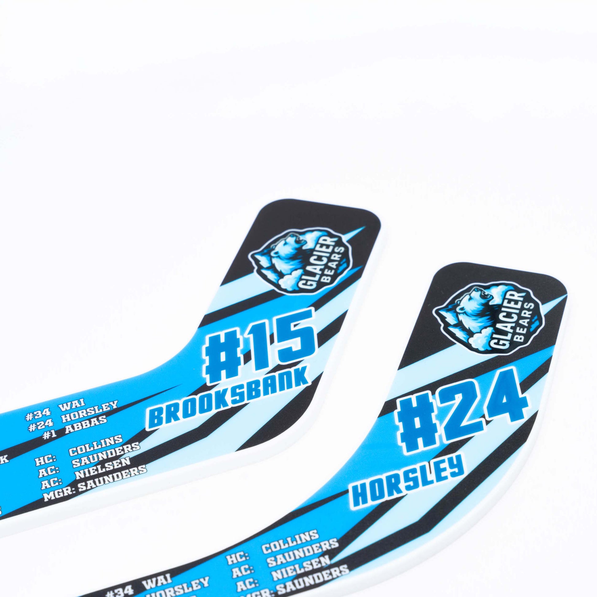 Two hockey stick blades with branding and numbers on a white background