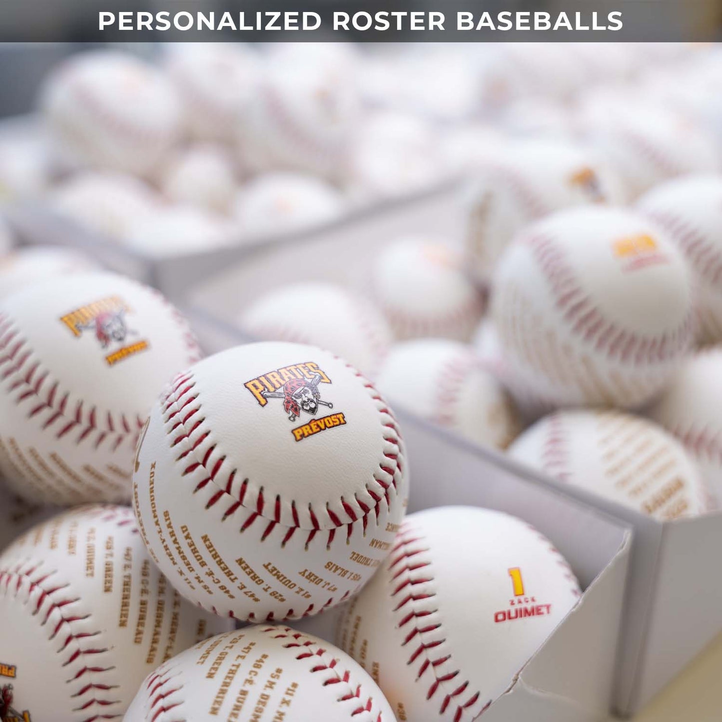 Baseballs with logos in a box on a blurred background