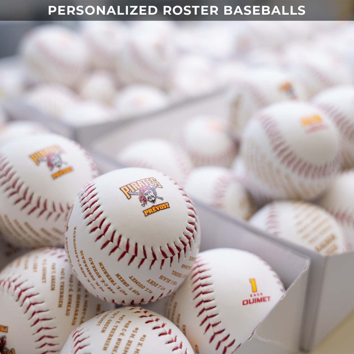 Baseballs with logos in a box on a blurred background