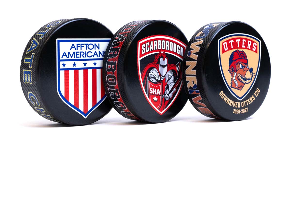 Three hockey pucks with team logos and color print on edge on a white background