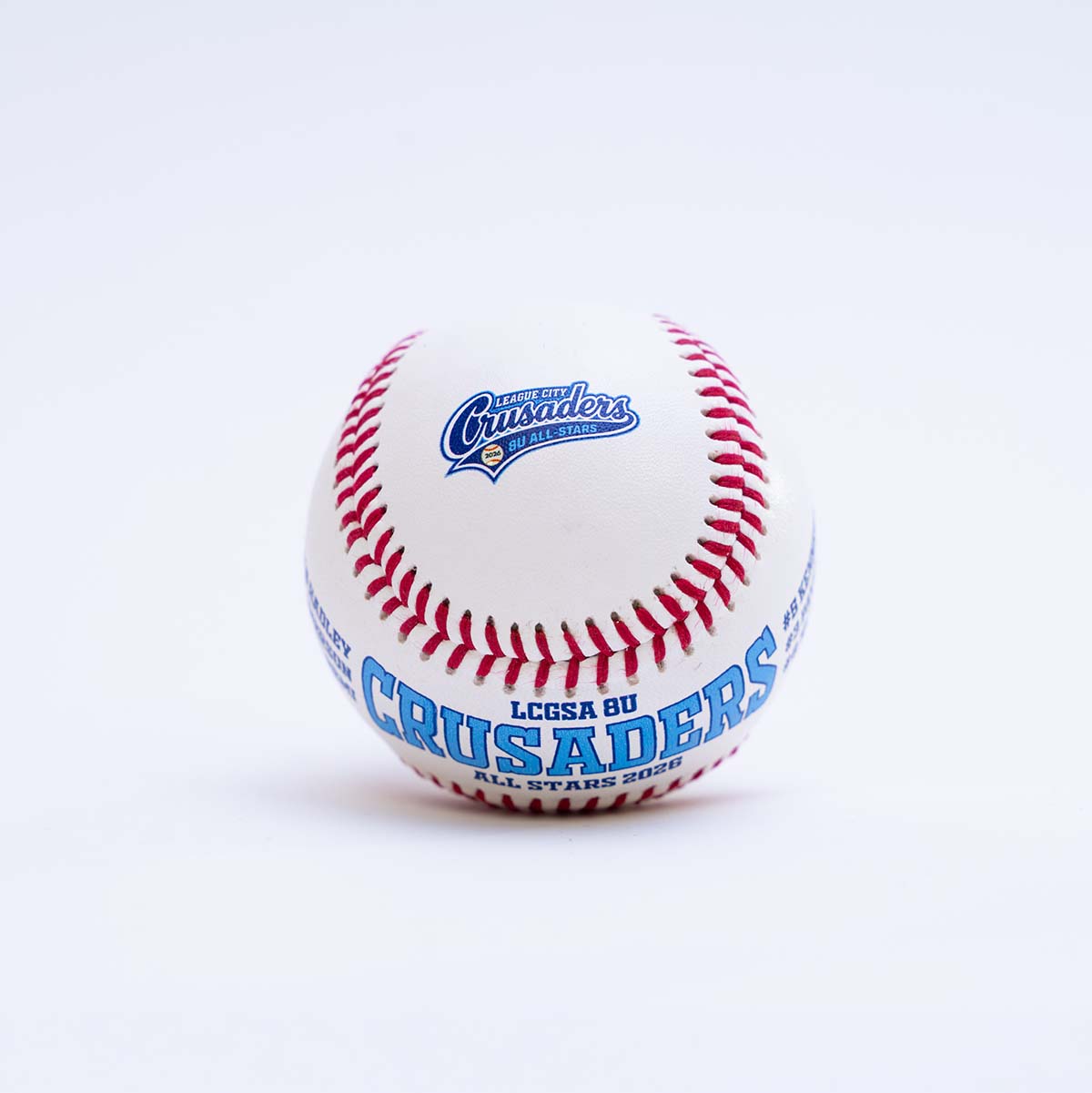 Baseball with 'LCGSA 8U Crusaders' text on a white background