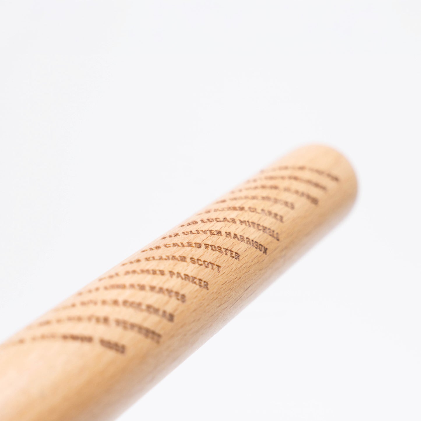 Closeup of engraved team roster on Mini Baseball Bat