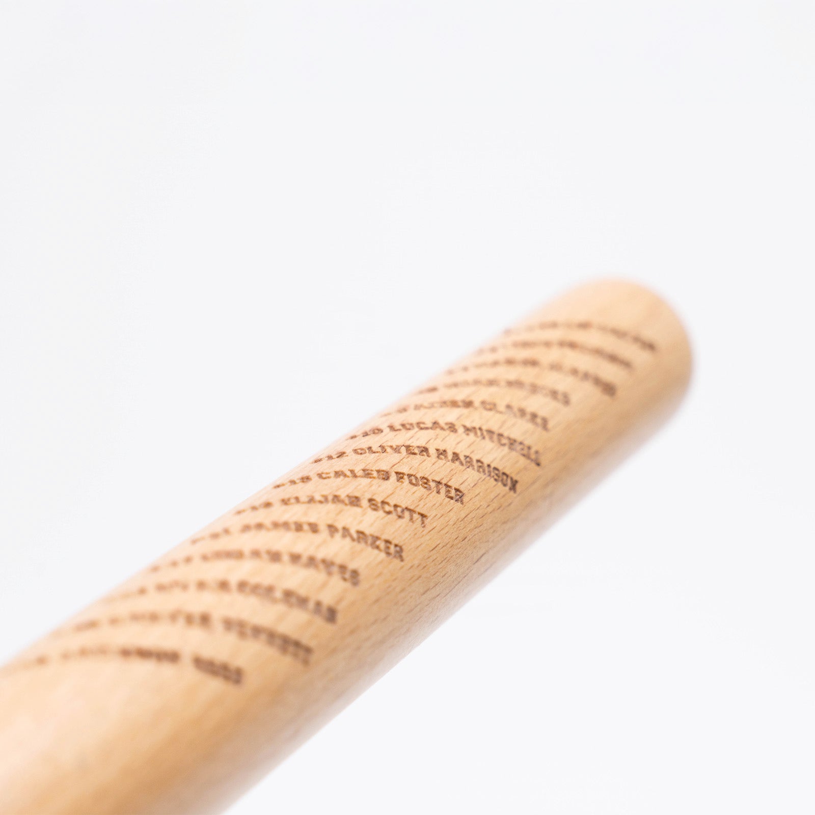 Closeup of engraved team roster on Mini Baseball Bat
