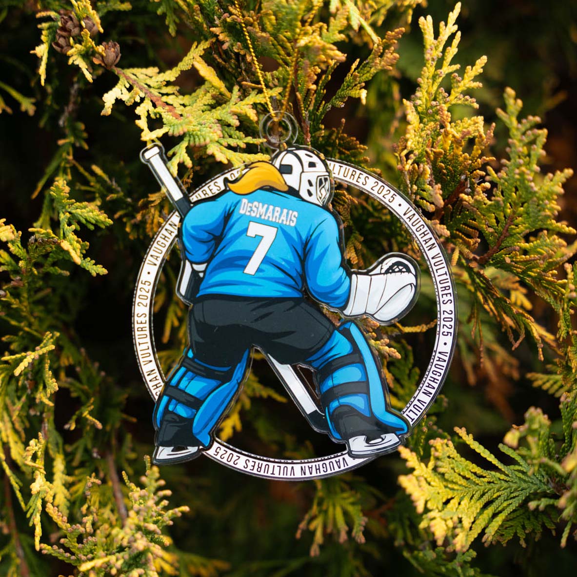Hockey ornament with a player in blue gear on a green leafy background