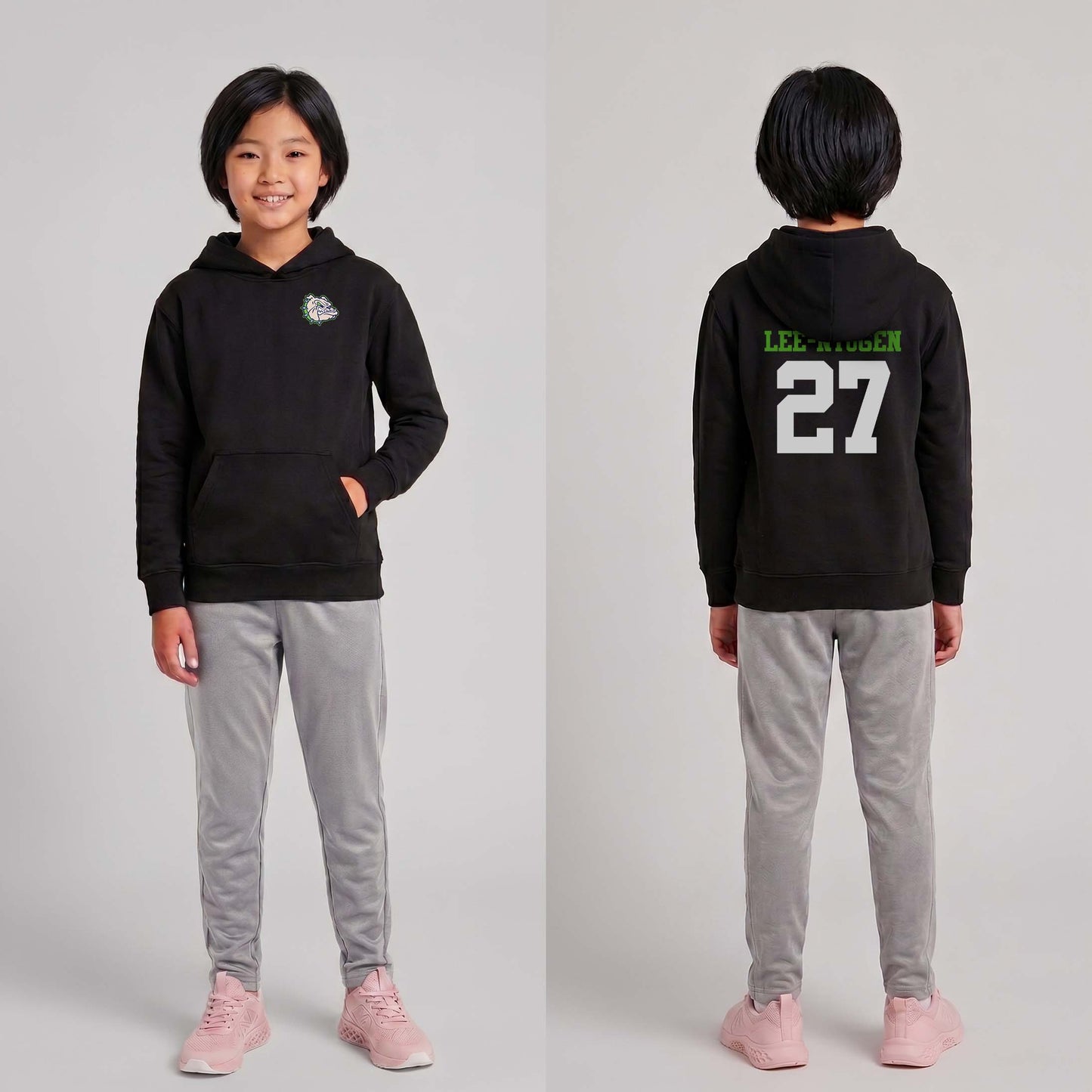 Child wearing a black hoodie with text and numbers, standing against a plain background